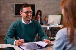 a man interviewing a woman